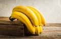 Branch of bananas on the rustic background Royalty Free Stock Photo