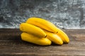Branch of bananas on the rustic background Royalty Free Stock Photo