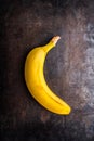 Branch of bananas on the rustic background Royalty Free Stock Photo
