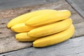 Branch of bananas on the rustic background. Selective focus. Shallow depth of field. Royalty Free Stock Photo