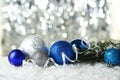 Branch of Christmas tree with balls on the snow Royalty Free Stock Photo