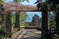 A branch covered viewing platform overlooking the sea in Devon, England