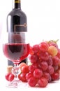 Branch of grapes, bottle of wine and glass Royalty Free Stock Photo