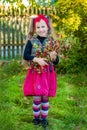 A branch of hawthorn in the hands of a cute girl in the garden. Royalty Free Stock Photo