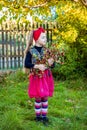 A branch of hawthorn in the hands of a cute girl in the garden. Royalty Free Stock Photo
