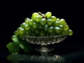 Branch of ripe green grape in a glass bowl. Juicy lush grapes over dark background, closeup shot