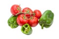 Branch of the ripe red tomatoes and green bell peppers Royalty Free Stock Photo