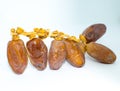 Branched Natural Kurma dates of Tunisia isolated on white background.