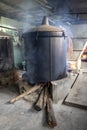 Branches from cajuput tree are placed inside a big pot for cajuput tree extraction