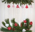 Branches of a Christmas tree, New Year`s decor on a light wooden background. Close-up. Design for postcards, banner. Royalty Free Stock Photo