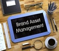 Brand Asset Management Concept on Small Chalkboard. 3D.