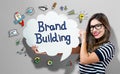 Brand Building text with woman holding a speech bubble Royalty Free Stock Photo