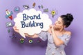 Brand Building with woman holding a speech bubble Royalty Free Stock Photo