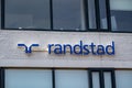 Brand name and logo on facade of local office building of employment agency Randstad Uitzendbureau, Hilversum, Netherlands