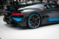 The brand new 2020 Bugatti Divo in Metallic black and Blue displayed in a car show in Dubai