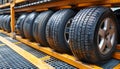 Brand new car tire on storage rack in warehouse, automotive tire inventory concept. Royalty Free Stock Photo