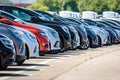 Brand new cars lined up in a parking lot Royalty Free Stock Photo