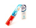 Brand new Colgate toothbrush and Crest Pro-Health Gum Detoxify toothpaste brand in USA neutralize plaque bacteria isolated on