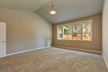 Brand new house construction interior. Empty room with vaulted ceiling.