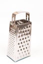 Brand new metal grater on the white background with copy space Royalty Free Stock Photo