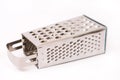 Brand new metal grater on the white background with copy space Royalty Free Stock Photo