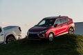 Brand new Mitsubishi Eclipse Cross SUV presented by a dealership on a artificial hill to sell the vehicle and promote the