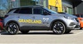 Brand new Opel Grandland X outside the local dealer of the german automaker. Side view.