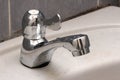 A brand new quarter turn one way tap faucet mounted on a wash basin sink Royalty Free Stock Photo