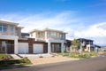 Brand new residential townhouses behind temporary construction fences in an Australian suburb. Concept of real estate development Royalty Free Stock Photo