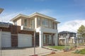 Brand new residential townhouses behind temporary construction fences in an Australian suburb. Concept of real estate development Royalty Free Stock Photo