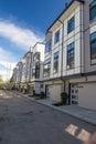 Brand new townhouse complex. Rows of townhomes side by side. External facade of a row of colorful modern urban townhouses. brand n Royalty Free Stock Photo