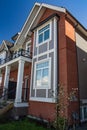 Brand new townhouse complex. Rows of townhomes side by side. External facade of a row of colorful modern urban townhouses. brand n Royalty Free Stock Photo