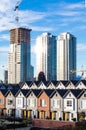 Brand new townhouses in a row on bright sunny day with Highrises in the background. Royalty Free Stock Photo