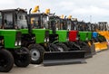 Brand new tractors in a line