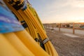 Rolls of plastic and rubber pipes and tubes laid against a wall inside a housing construction site Royalty Free Stock Photo