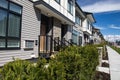 Brand new upscale townhomes in a Canadian neighbourhood. External facade of a row of colorful modern urban townhouses.brand new ho Royalty Free Stock Photo