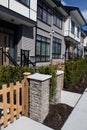 Brand new upscale townhomes in a Canadian neighbourhood. External facade of a row of colorful modern urban townhouses.brand new ho Royalty Free Stock Photo