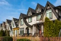 Brand new upscale townhomes in a Canadian neighbourhood. External facade of a row of modern urban townhouses Royalty Free Stock Photo