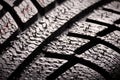 Brand new winter tire pattern on black background Royalty Free Stock Photo