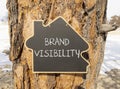 Brand visibility symbol. Concept words Brand visibility on beautiful black house blackboard. Beautiful tree background. Business Royalty Free Stock Photo