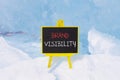 Brand visibility symbol. Concept words Brand visibility on beautiful yellow black blackboard. Beautiful blue ice background. Royalty Free Stock Photo