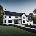 A brand white contemporary farmhouse with a dark shingled roof and black windows