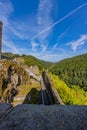 Brandenburg castle ruins, destroyed walls, metal walkway, stairs, rock formation, hills with green lush trees