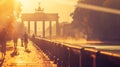 Brandenburg Gate is bathed in the warm glow of an autumn sunrise.