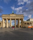The Brandenburg Gate in Berlin, Germany, against a beautiful blue sky with some clouds