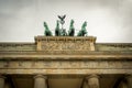 Brandenburg Gate quadriga under heavy dramatic sky Royalty Free Stock Photo