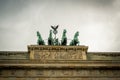 Brandenburg Gate quadriga under heavy dramatic sky Royalty Free Stock Photo