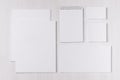 Branding business mock up of white blank stationery set on light soft white wooden background.