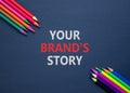 Branding and your brand story symbol. Concept words Your brands story on beautiful black paper. Beautiful black background.