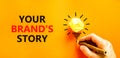 Branding and your brand story symbol. Concept words Your brands story on beautiful orange paper. Beautiful orange background.